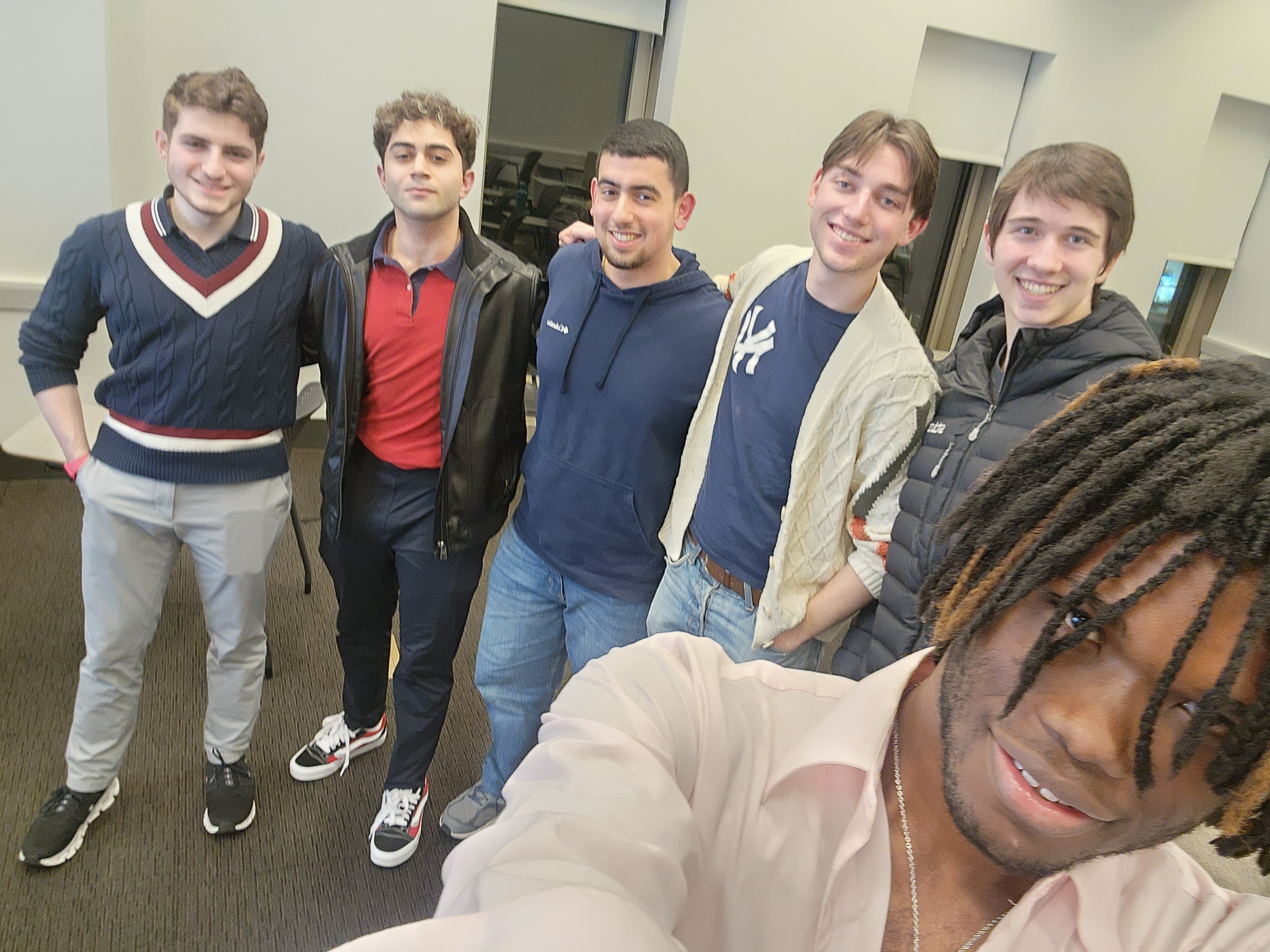 Debaters brainstorming with notes on a whiteboard