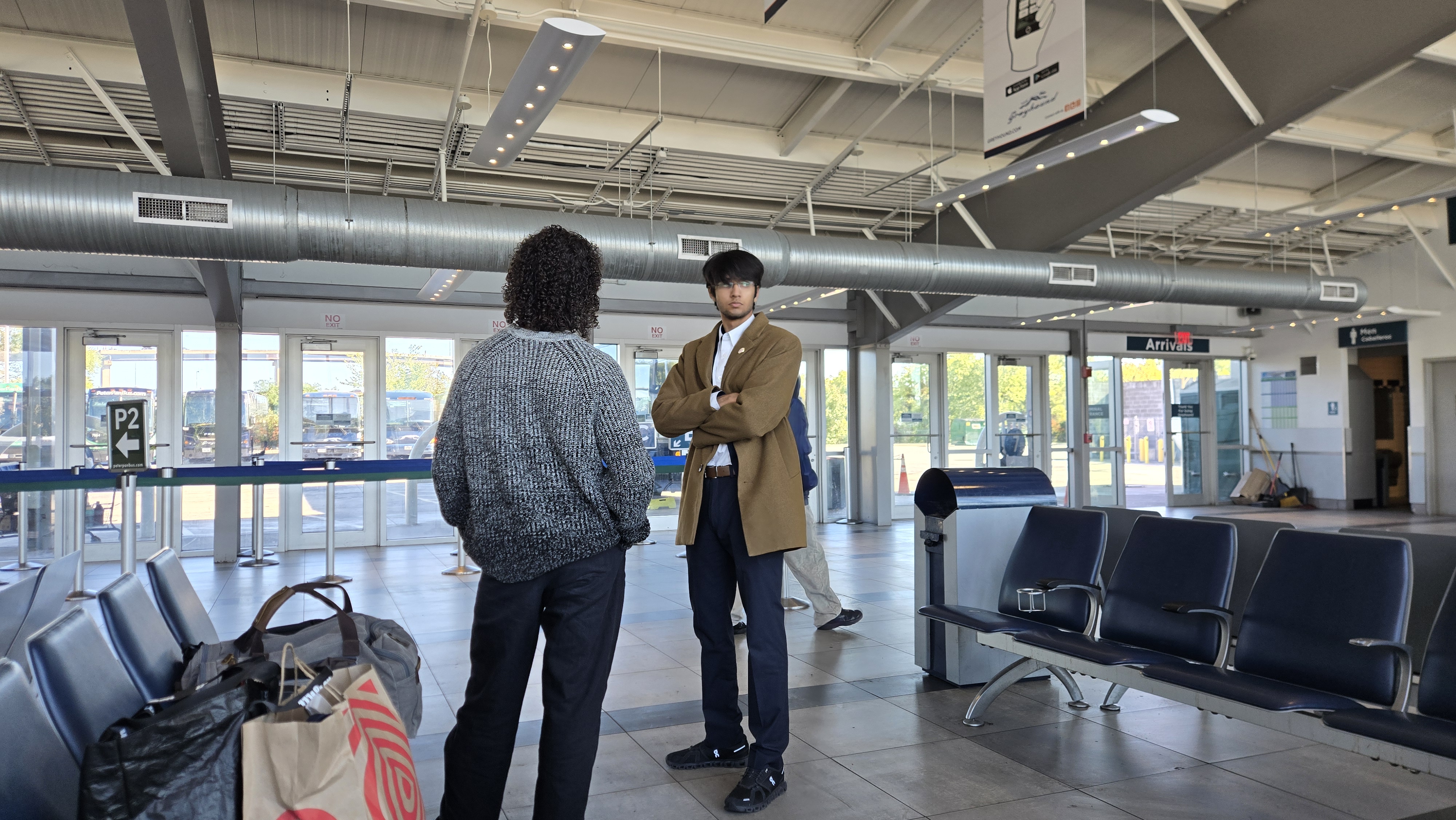 Debaters standing together in afternoon sun at Johns Hopkins