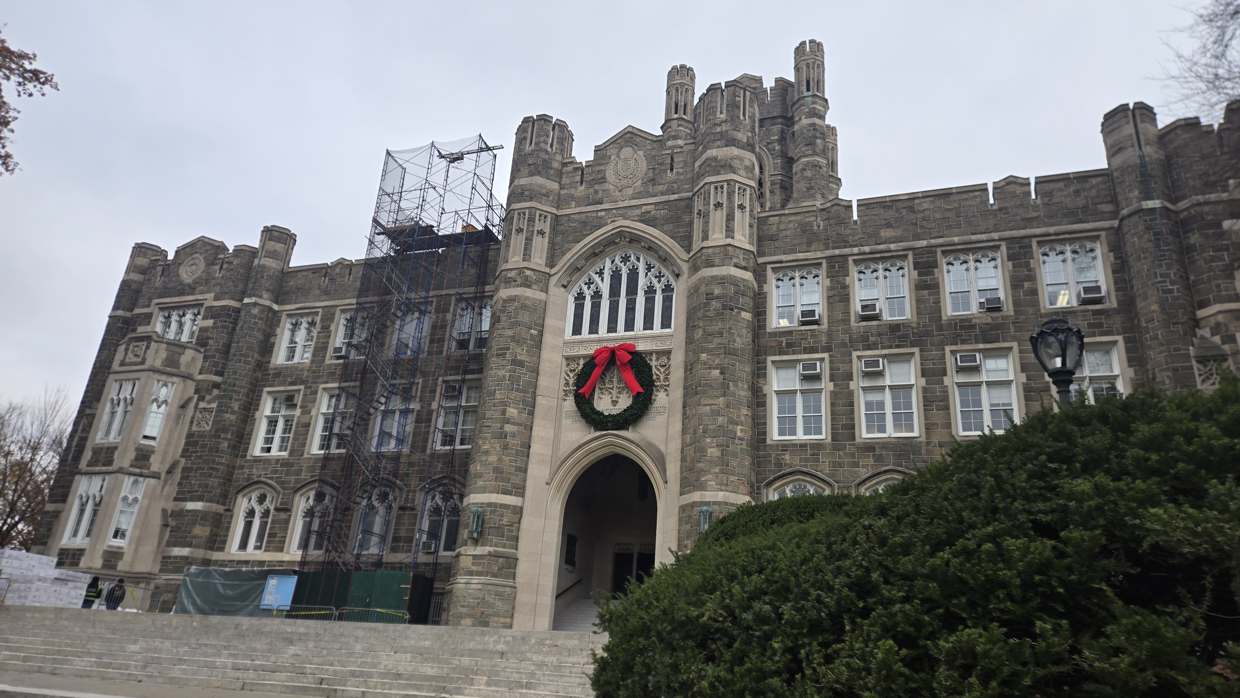 Squad comparing notes in a Fordham hallway