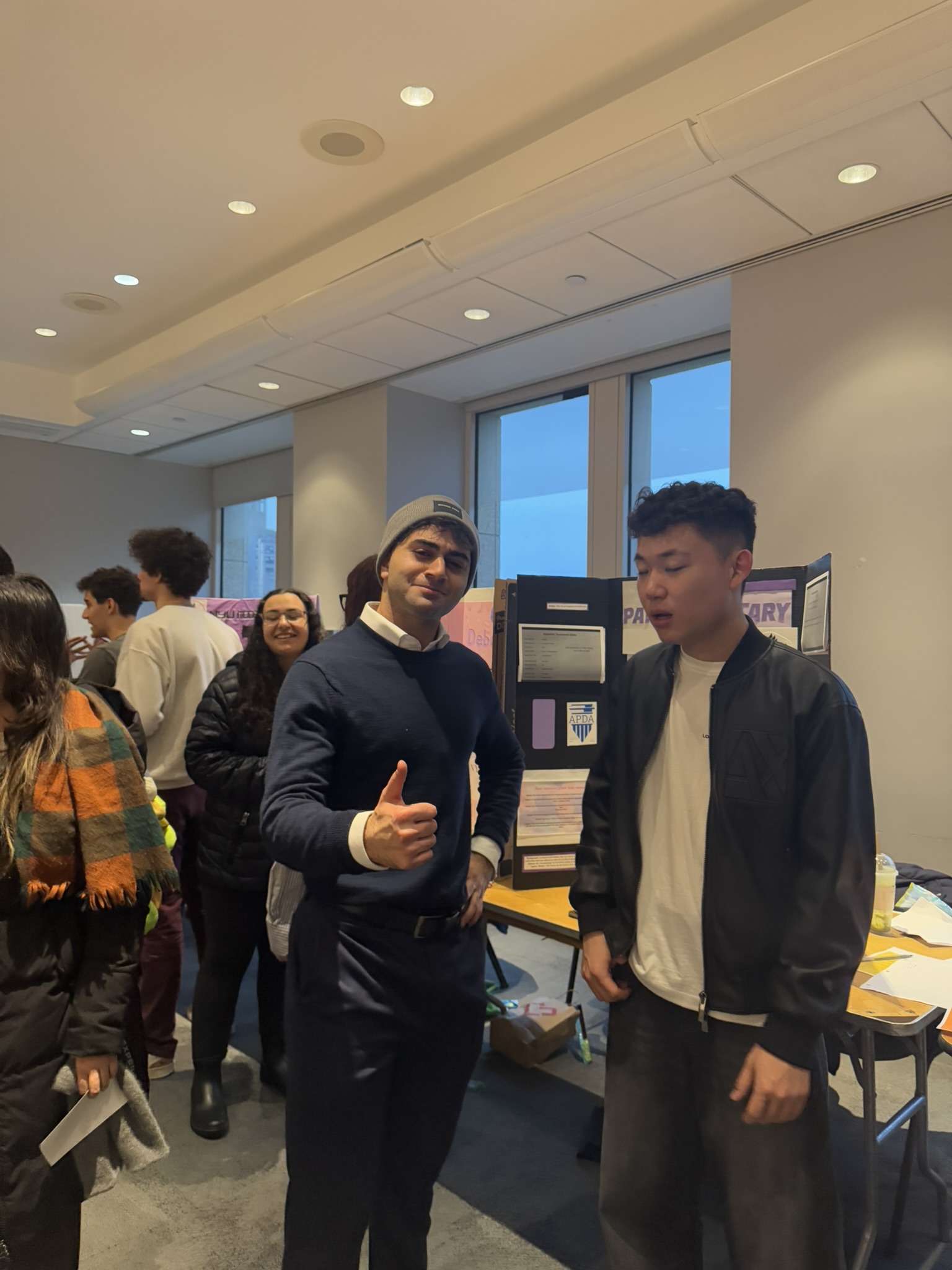 Team photo with NYU debaters